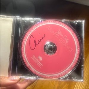 Ariana Grande signed “Yours Truly” rare cd on hold